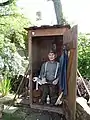 This display shows children  what toilets in rural areas in Germany used to look like in the recent past.