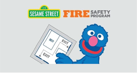Grover from Sesame Street holding an evacuation plan